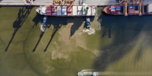 What will it take for ships to start sailing through the Strait of Hormuz again?