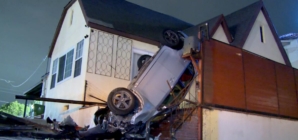 Car flips, winds up vertical on the porch of an L.A. home