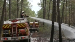 France makes major progress in wildfire fight, but danger still lurks