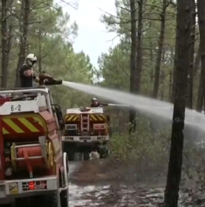 France makes major progress in wildfire fight, but danger still lurks