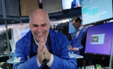 Dow soars 900 points on strong corporate earnings and hopes of Iran deal
