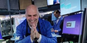 Dow soars 900 points on strong corporate earnings and hopes of Iran deal