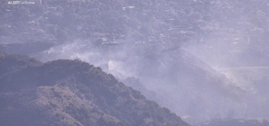 Firefighters battling brush fire in Burb